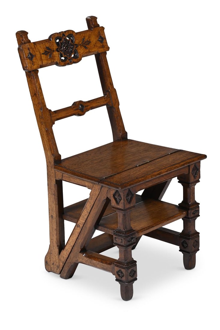 A VICTORIAN CARVED OAK METAMORPHIC LIBRARY CHAIR, IN THE MANNER OF CHARLES BEVAN, CIRCA 1880 (1 of 3)
