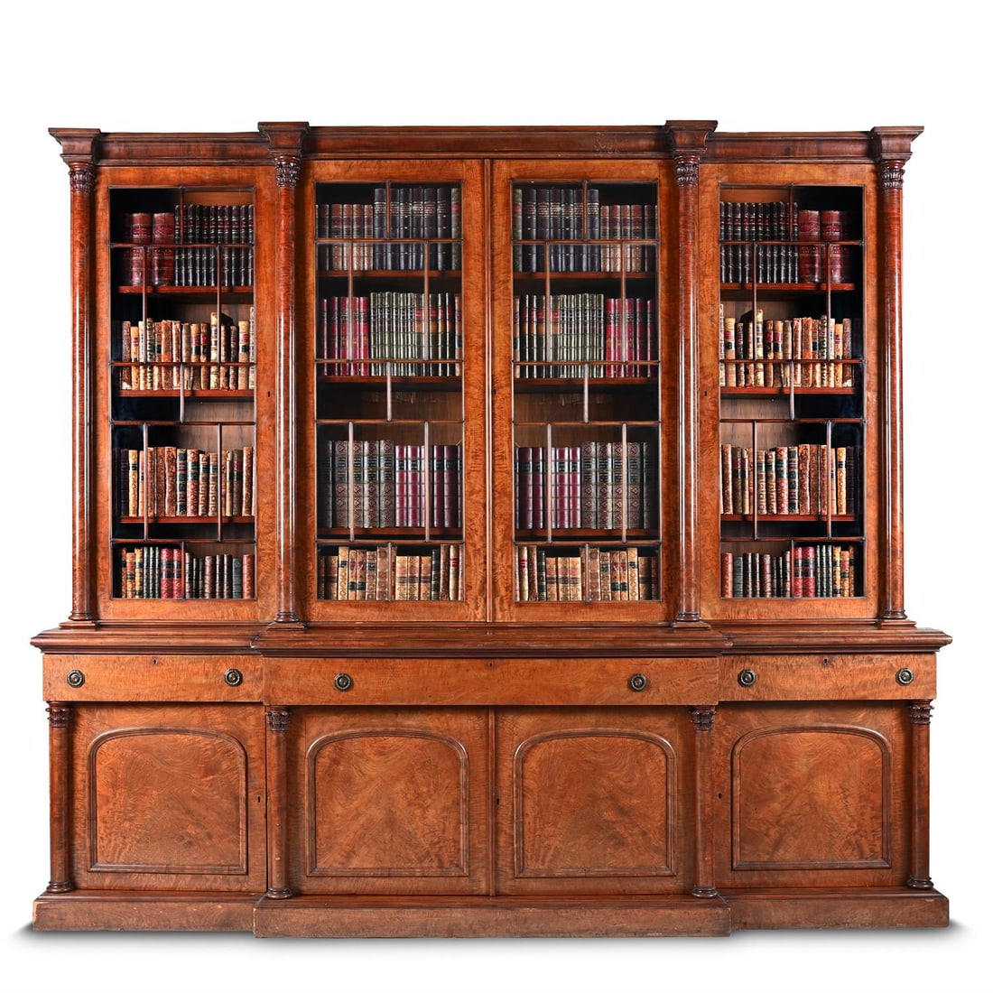 A WILLIAM IV FIDDLEBACK MAHOGANY BREAKFRONT LIBRARY SECRETAIRE BOOKCASE, PROBABLY IRISH, CIRCA 1835 (1 of 5)