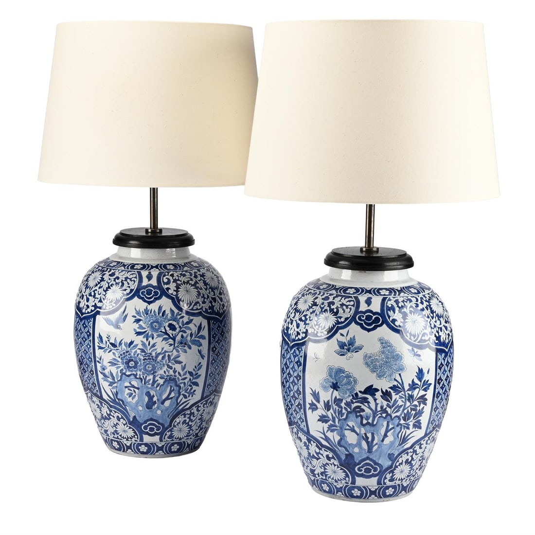A PAIR OF DUTCH BLUE AND WHITE CERAMIC LAMP BASES, EARLY 20TH CENTURY: A PAIR OF DUTCH BLUE AND WHITE CERAMIC LAMP BASES EARLY 20TH CENTURY Decorated in blue and white in the Chinese manner, marked to underside MWB 1757, fitted as lamps with shades 66.5cm high overall