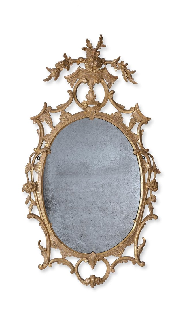 A GEORGE III CARVED GILTWOOD MIRROR, IN THE MANNER OF THOMAS CHIPPENDALE, CIRCA 1770 (1 of 2)