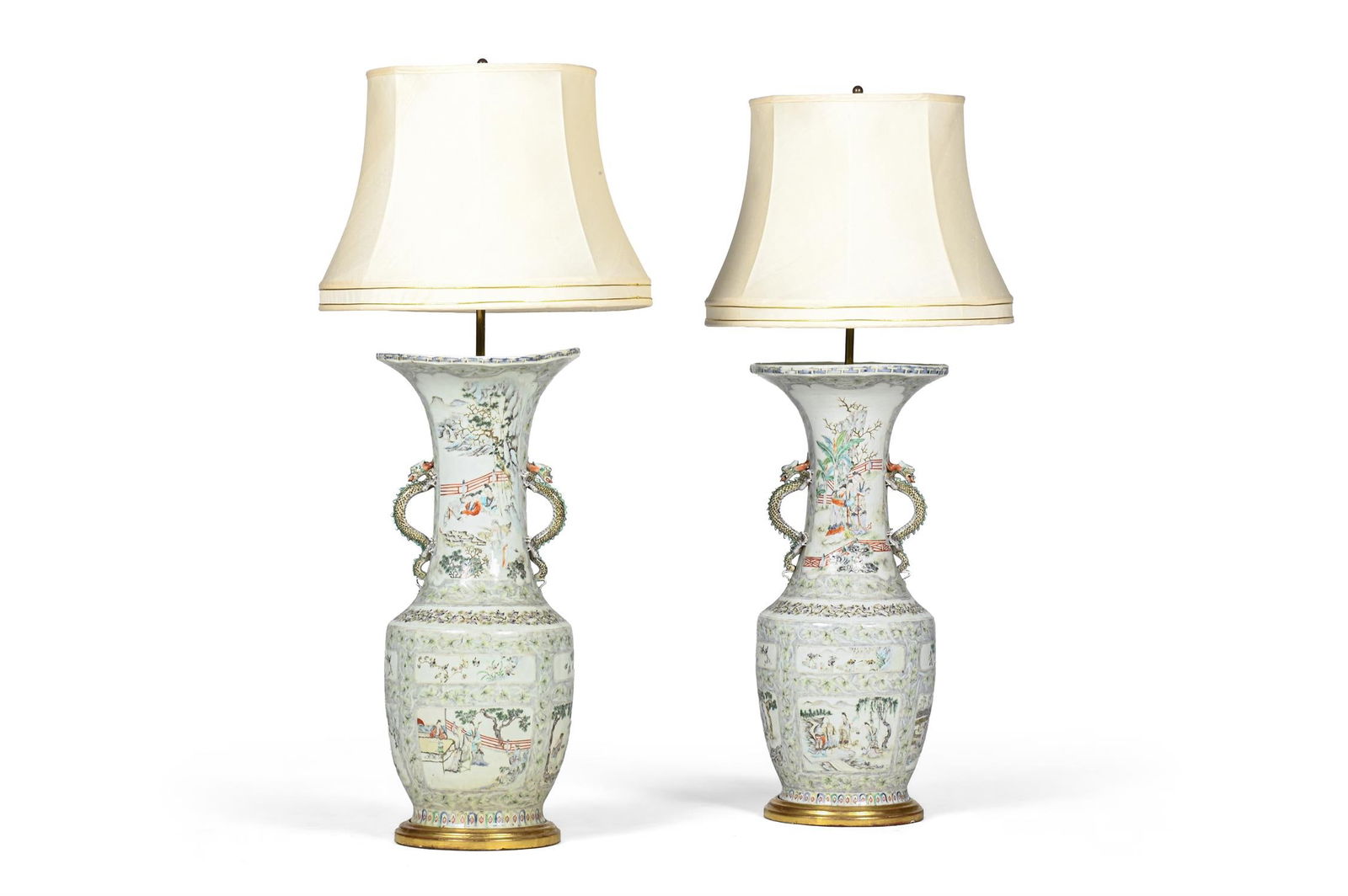 A LARGE PAIR OF CHINESE FAMILLE VERT LAMPS, 19TH CENTURY: A LARGE PAIR OF CHINESE FAMILLE VERT LAMPS19TH CENTURYOn giltwood bases108cm high to top of fitment, the base 29cm diameter