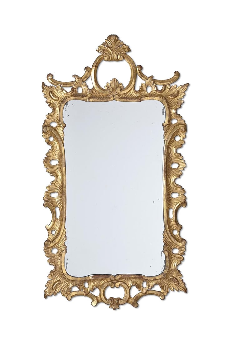 A GEORGE III CARVED GILTWOOD MIRROR, IN THE MANNER OF THOMAS CHIPPENDALE, CIRCA 1760 (1 of 2)