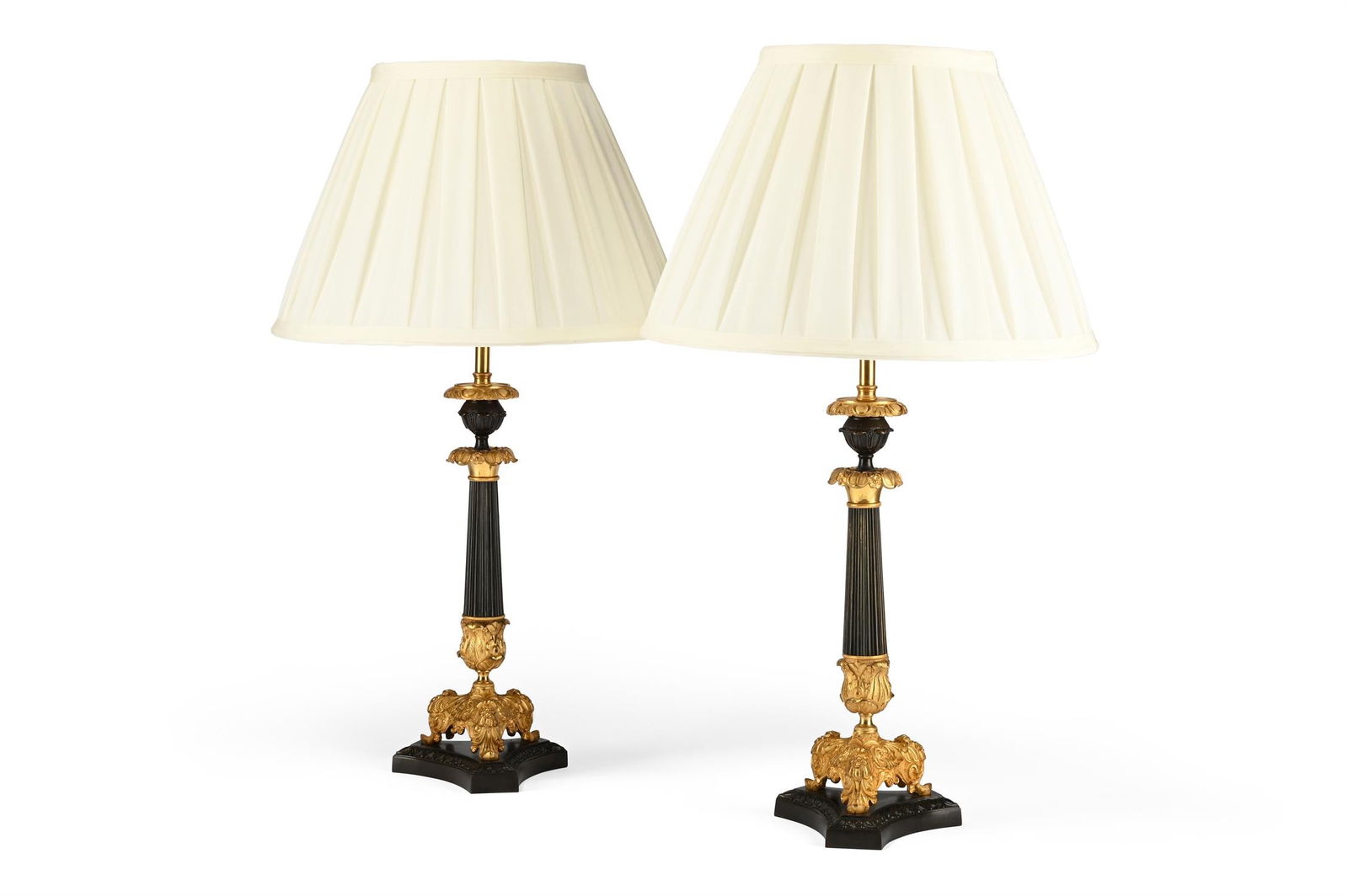 A PAIR OF TRIFORM BRONZE AND GILT TABLE LIGHTS, SECOND QUARTER 19TH CENTURY (1 of 2)