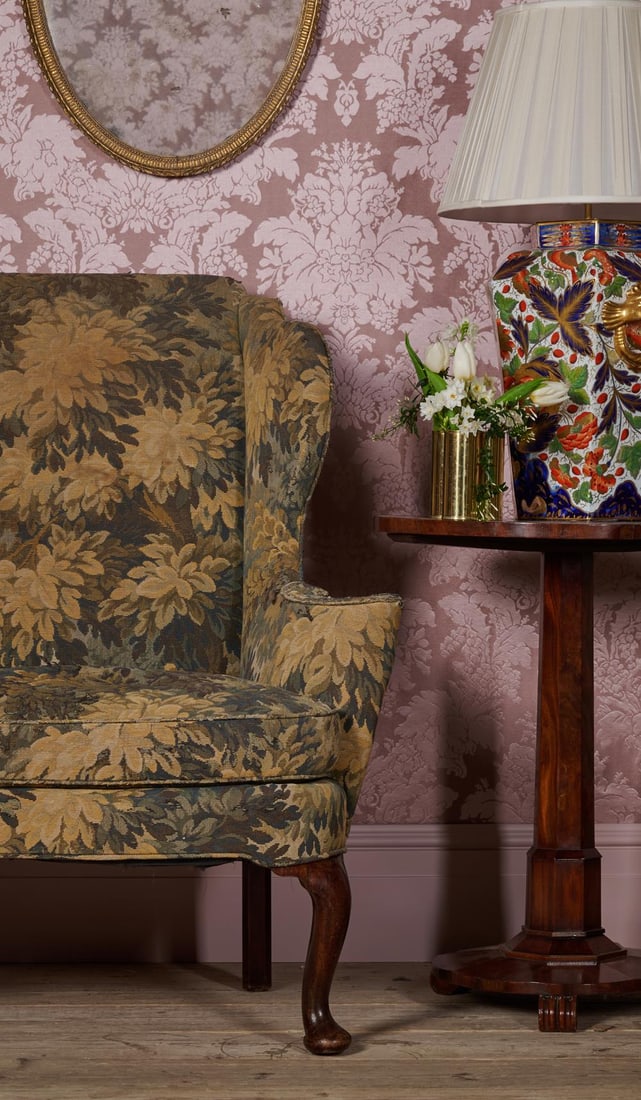 A GEORGE III MAHOGANY WING BACK ARMCHAIR, CIRCA 1770: A GEORGE III MAHOGANY WING BACK ARMCHAIRCIRCA 1770With verdure upholstery108cm high, 72cm wide, 57cm deep