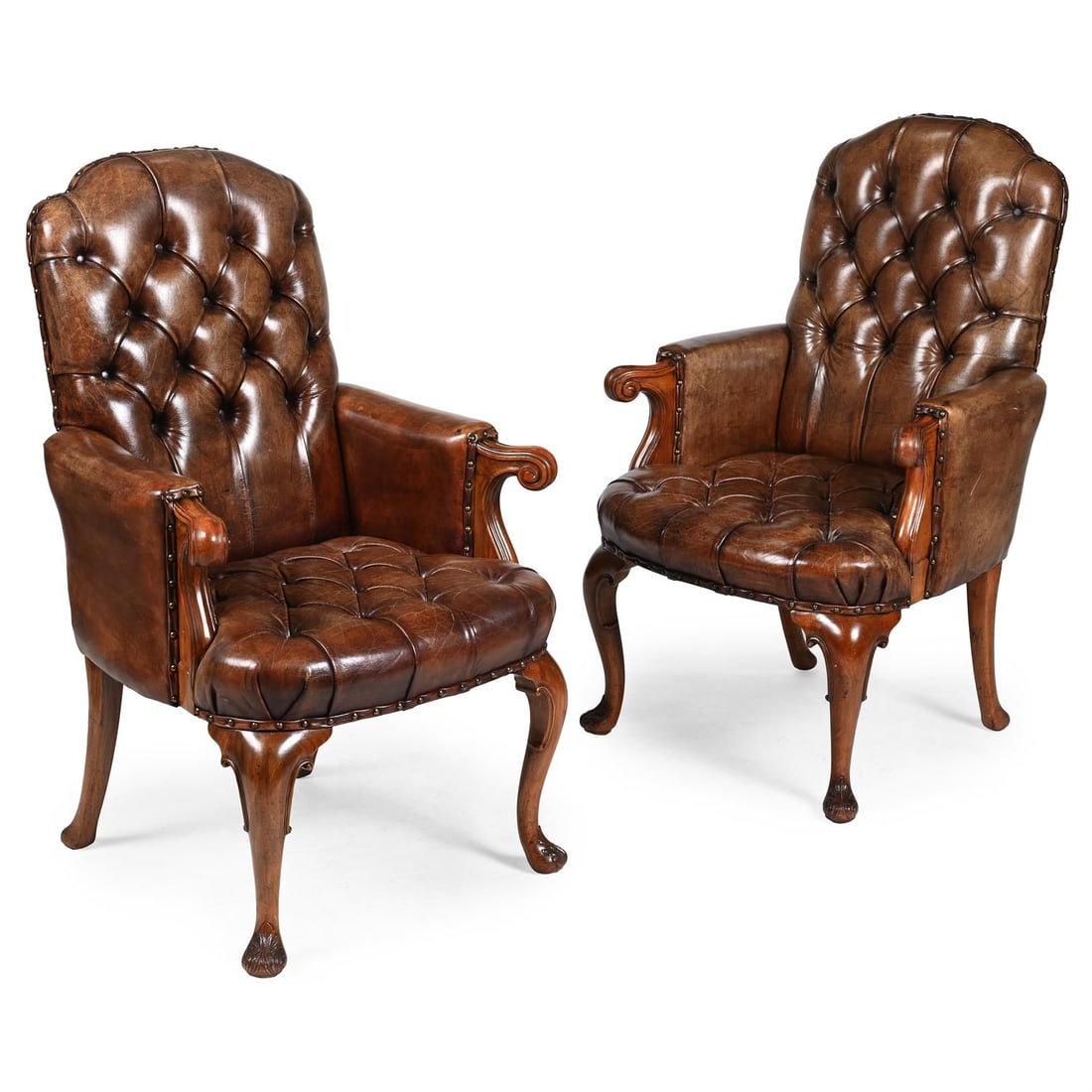 A PAIR OF WALNUT AND BUTTONED LEATHER UPHOLSTERED LIBRARY ARMCHAIRS, IN GEORGE I STYLE (1 of 3)