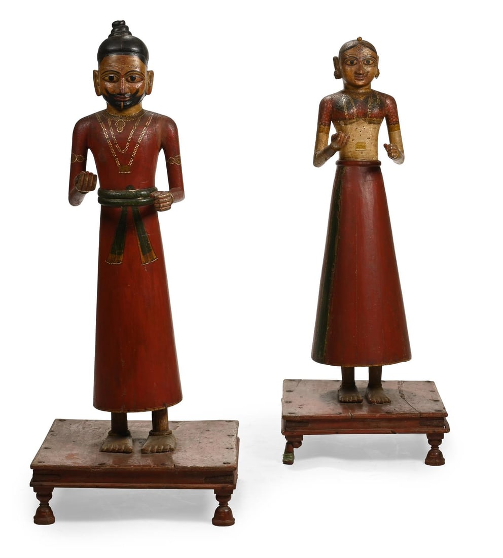 A LARGE PAIR OF POLYCHROME DECORATED CARVED WOOD FIGURES OF A MAN AND A WOMAN, INDIAN, 20TH CENTURY (1 of 3)