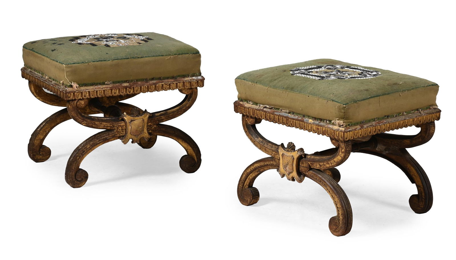 A PAIR OF VICTORIAN CARVED GILTWOOD AND UPHOLSTERED X FRAME STOOLS, MID 19TH CENTURY (1 of 3)