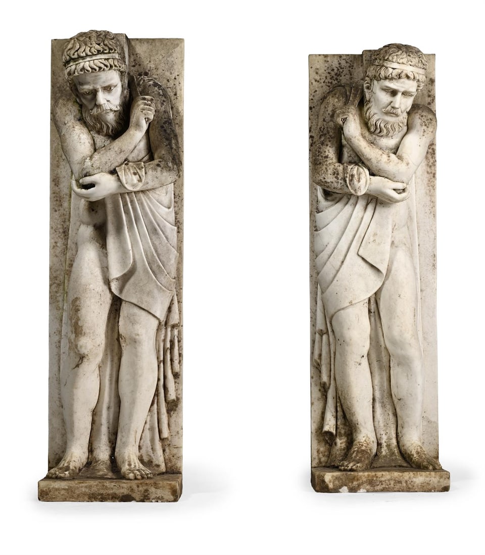 A PAIR OF CARVED WHITE MARBLE JAMBS IN 18TH CENTURY STYLE: A PAIR OF CARVED WHITE MARBLE JAMBS IN 18TH CENTURY STYLE, 20TH CENTURYEach carved with a classical male supporter 96.5cm high, 29cm wide, 22cm deep