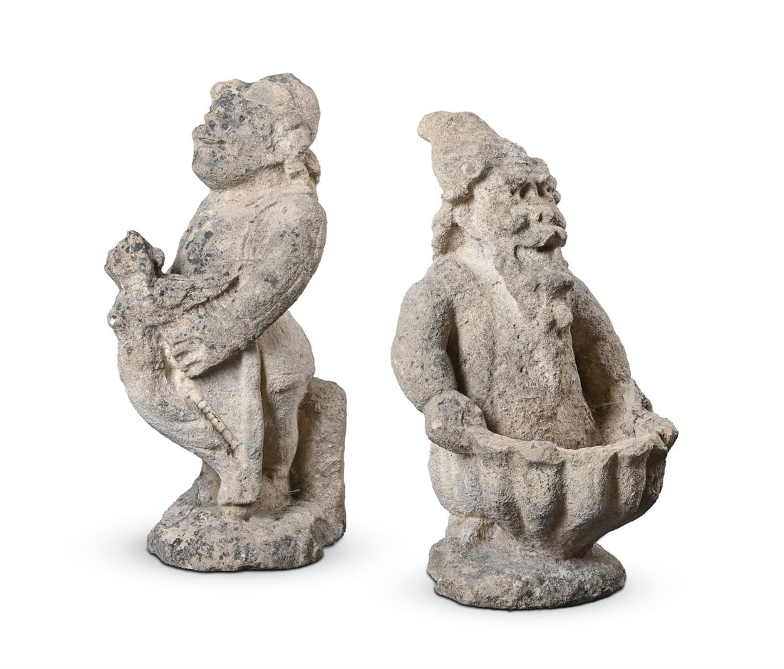 TWO CARVED LIMESTONE GNOMES, 19TH CENTURY (1 of 4)
