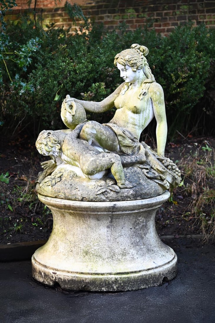 A LARGE STONE COMPOSITION FOUNTAIN, LATE 20TH CENTURY: A LARGE STONE COMPOSITION FOUNTAIN LATE 20TH CENTURY Modelled with a reclining woman among foliage, on an oval base approximately 145cm high overall, the base 91.5cm wide