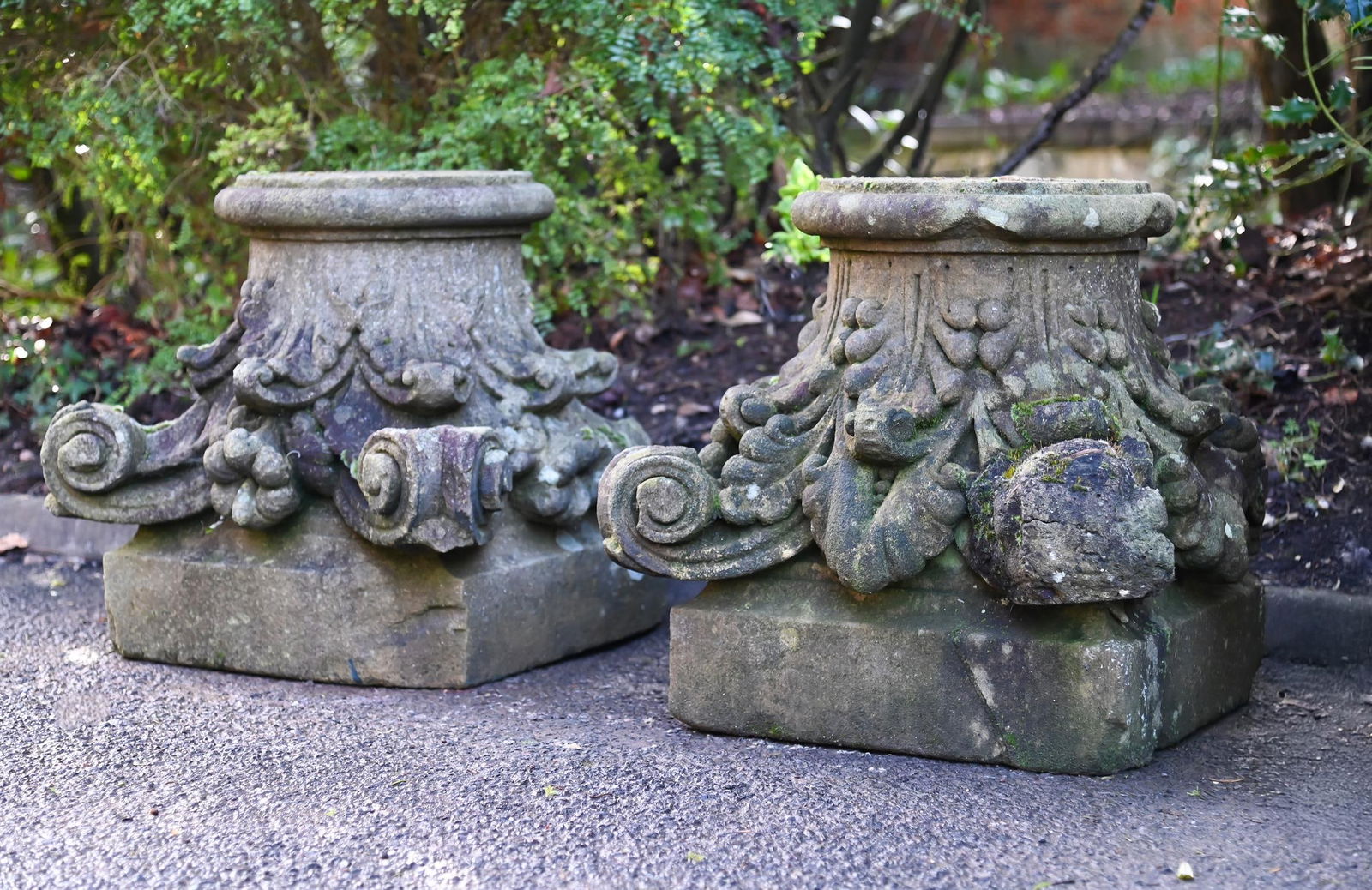 A LARGE PAIR OF COMPOSITION STONE CORINTHIAN CAPITALS, LATE 20TH CENTURY: A LARGE PAIR OF COMPOSITION STONE CORINTHIAN CAPITALS LATE 20TH CENTURY 53cm high, 53.5cm wide, 50.5cm deep
