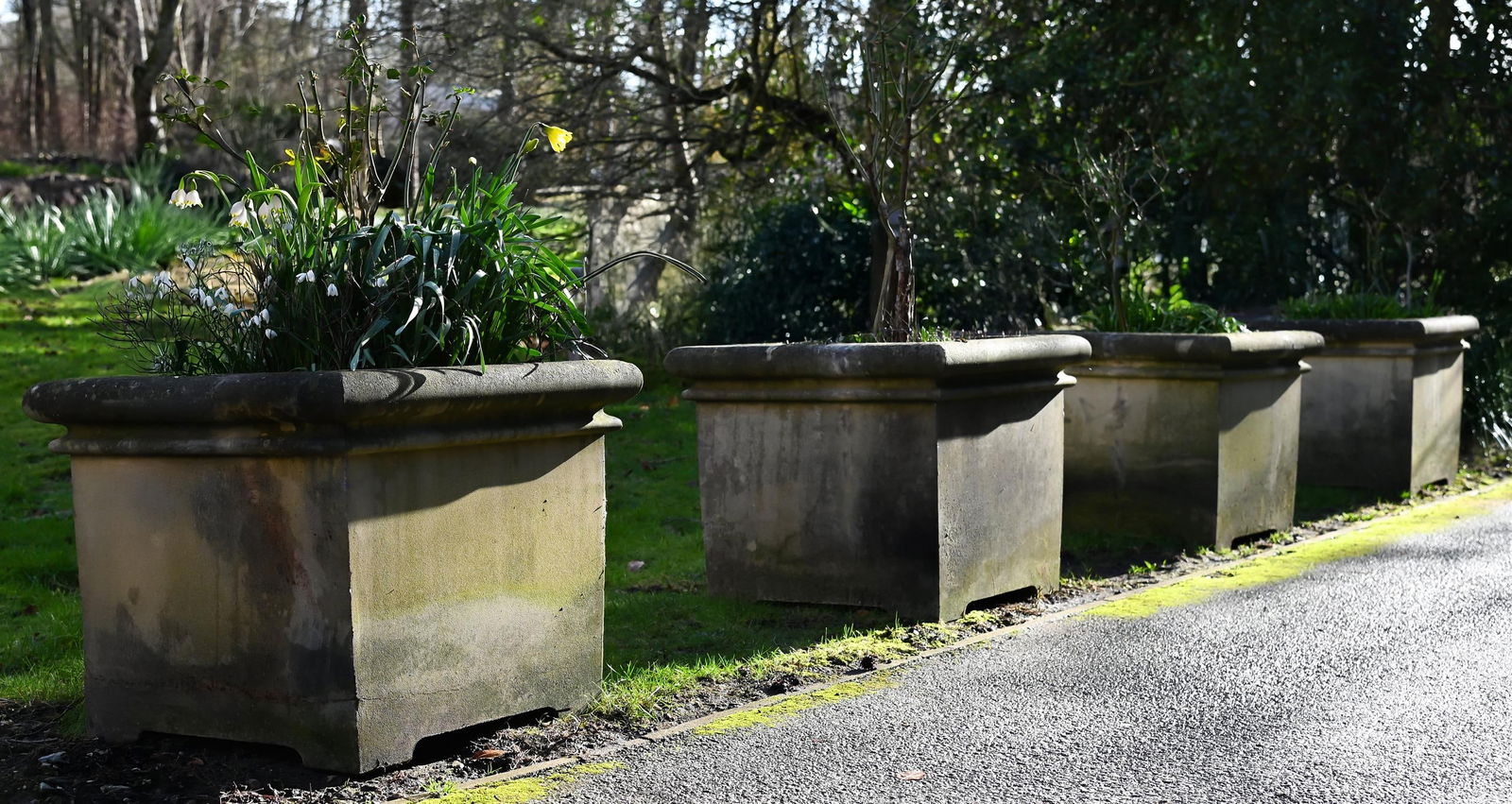 A SET OF FOUR COMPOSITION PLANTERS, 20TH CENTURY (1 of 1)
