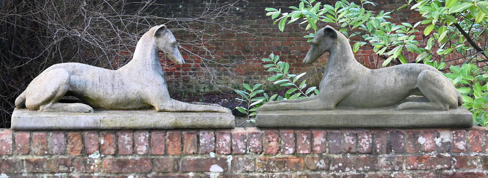A PAIR OF COMPOSITION STONE GREYHOUNDS, AFTER THE MODEL BY AUSTIN SEELEY, 20TH CENTURY (1 of 1)