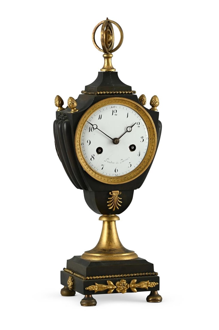 A FRENCH EMPIRE ORMOLU AND PATINATED BRASS URN MANTEL CLOCK (1 of 3)