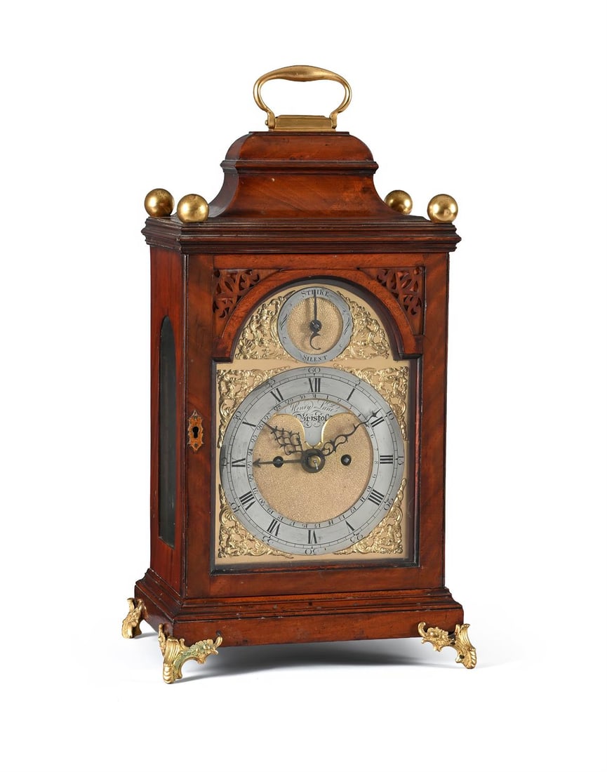 A GEORGE III FIGURED MAHOGANY TABLE/BRACKET CLOCK WITH CONCENTRIC CALENDAR (1 of 3)