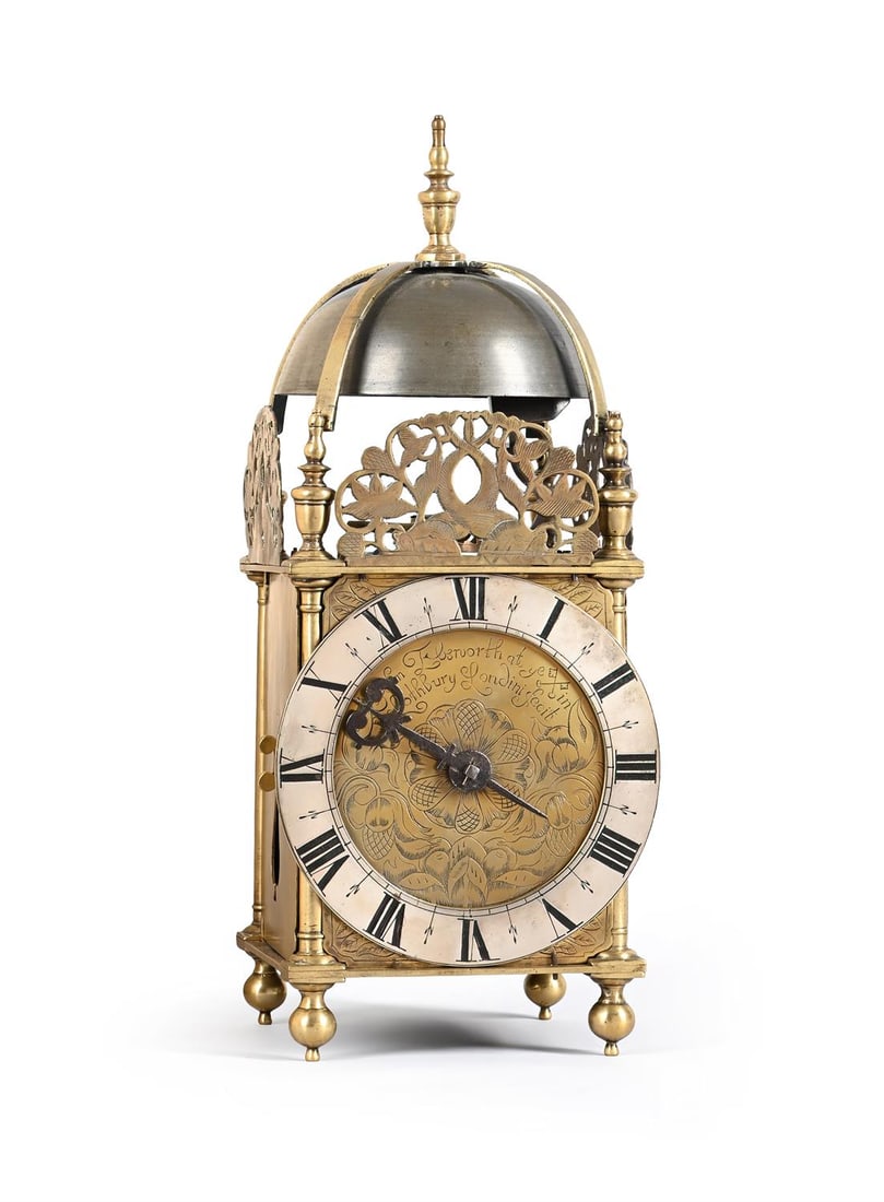 A CHARLES II BRASS LANTERN CLOCK WITH CENTRE-SWINGING PENDULUM (1 of 5)