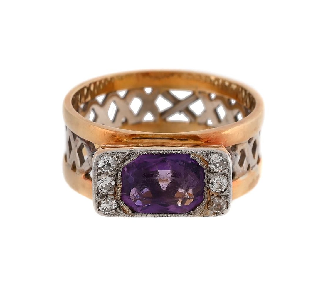 AN AMETHYST AND DIAMOND DRESS RING: AN AMETHYST AND DIAMOND DRESS RING The octagonal cut amethyst and single cut diamond set panel above a pierced lattice shank, stamped 18kt Size/dimensions: ring size O 1/2 Gross