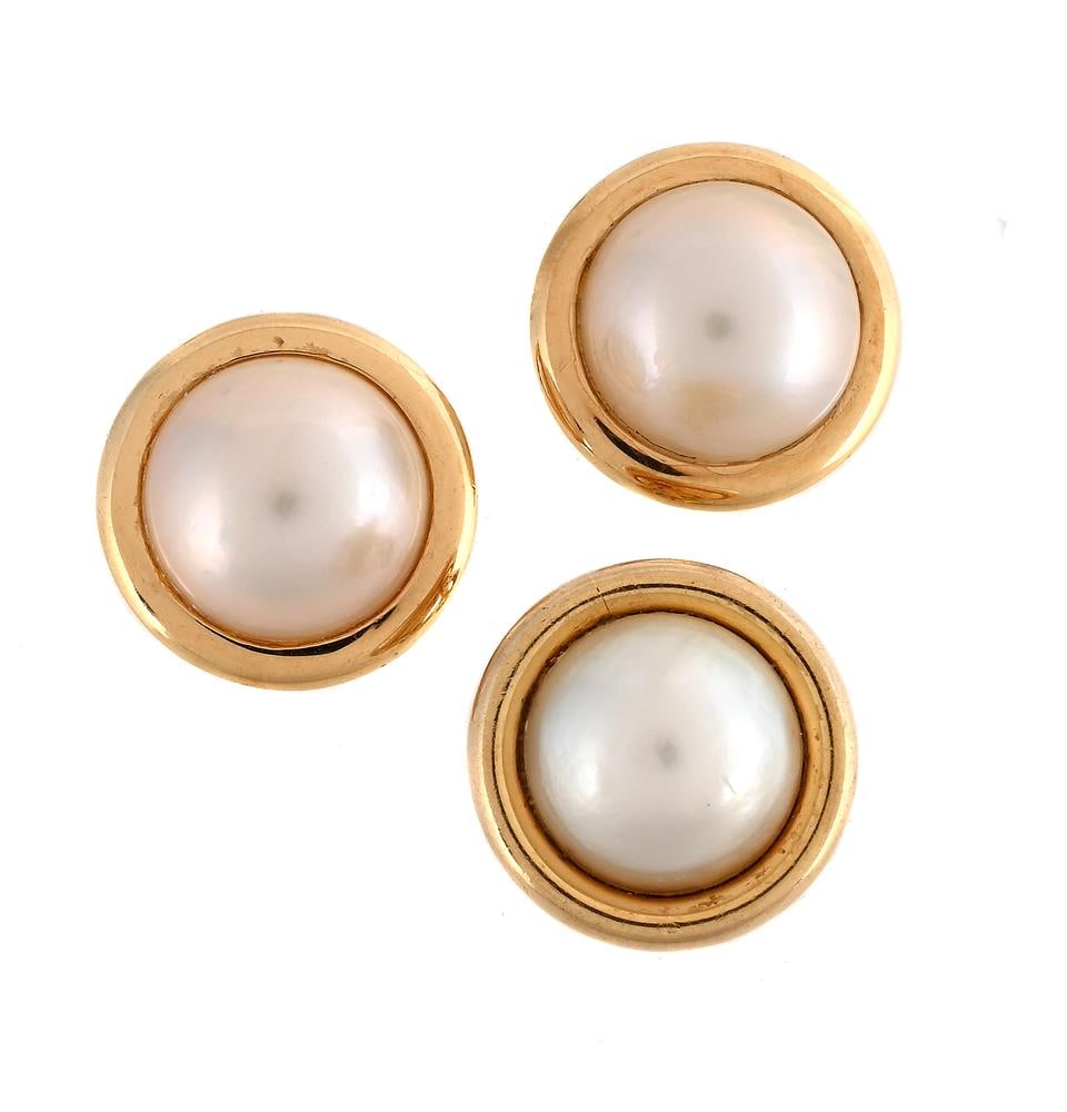 A PAIR OF MABÉ PEARL EARRINGS: A PAIR OF MABÉ PEARL EARRINGS The earrings with a mabé pearl within a polished surround, clip fittings, unmarked; together with a single mabé pearl and 9 carat gold