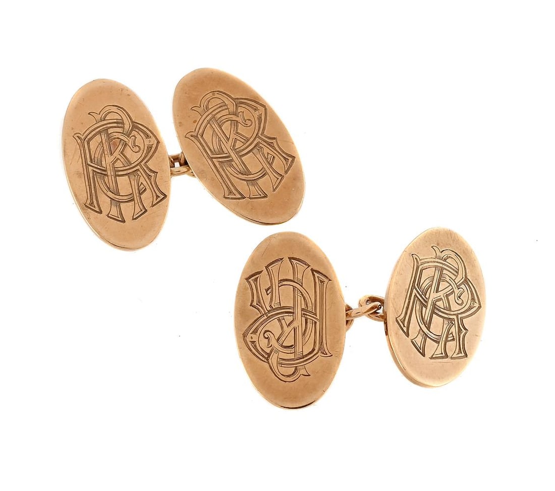 A PAIR OF 9 CARAT GOLD CUFFLINKS: A PAIR OF 9 CARAT GOLD CUFFLINKS The matched pair with oval panels engraved with monograms, to belcher link connectors, one Deakin & Francis, Birmingham 1954, the other with H&H S
