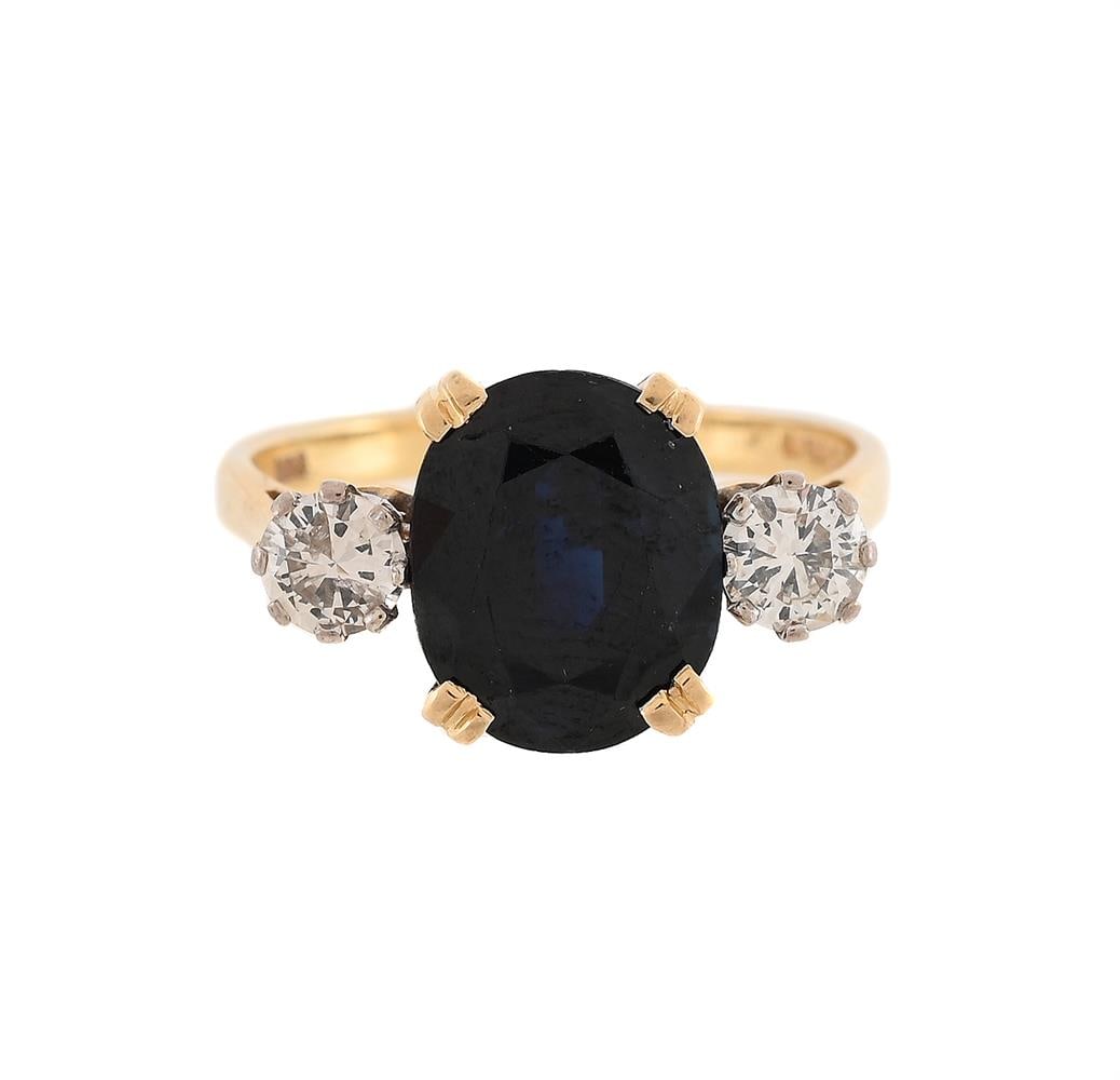 A DIAMOND AND SAPPHIRE THREE STONE RING (1 of 2)