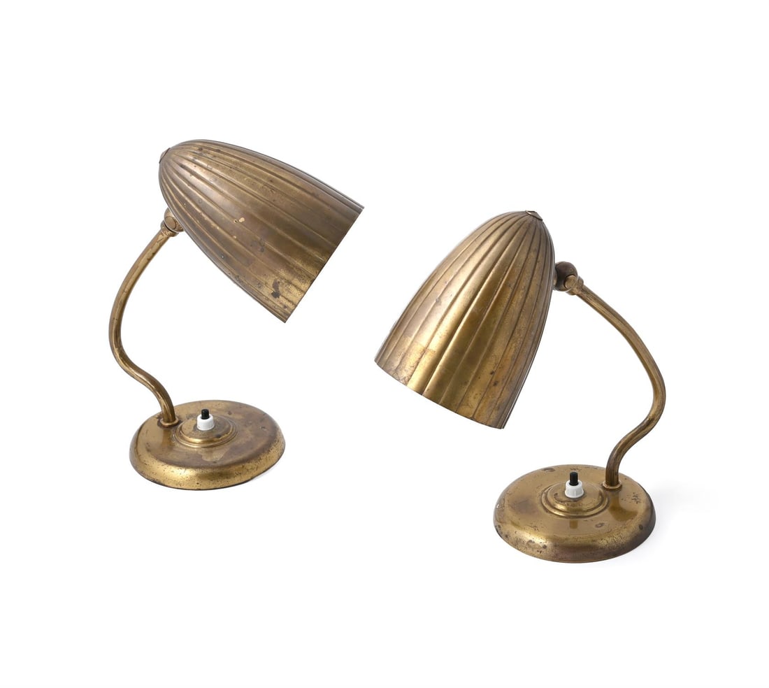 HARALD NOTINI (SWEDISH, 1879-1959), A PAIR OF 'MODEL 15470' TABLE LAMPS, CIRCA 1940: HARALD NOTINI (SWEDISH, 1879-1959)A PAIR OF 'MODEL 15470' TABLE LAMPS, CIRCA 1940Gilt metal, adjustable shades26.5cm highHarald Notini was Artistic Director at Böhlmarks, the leading Scandinavian