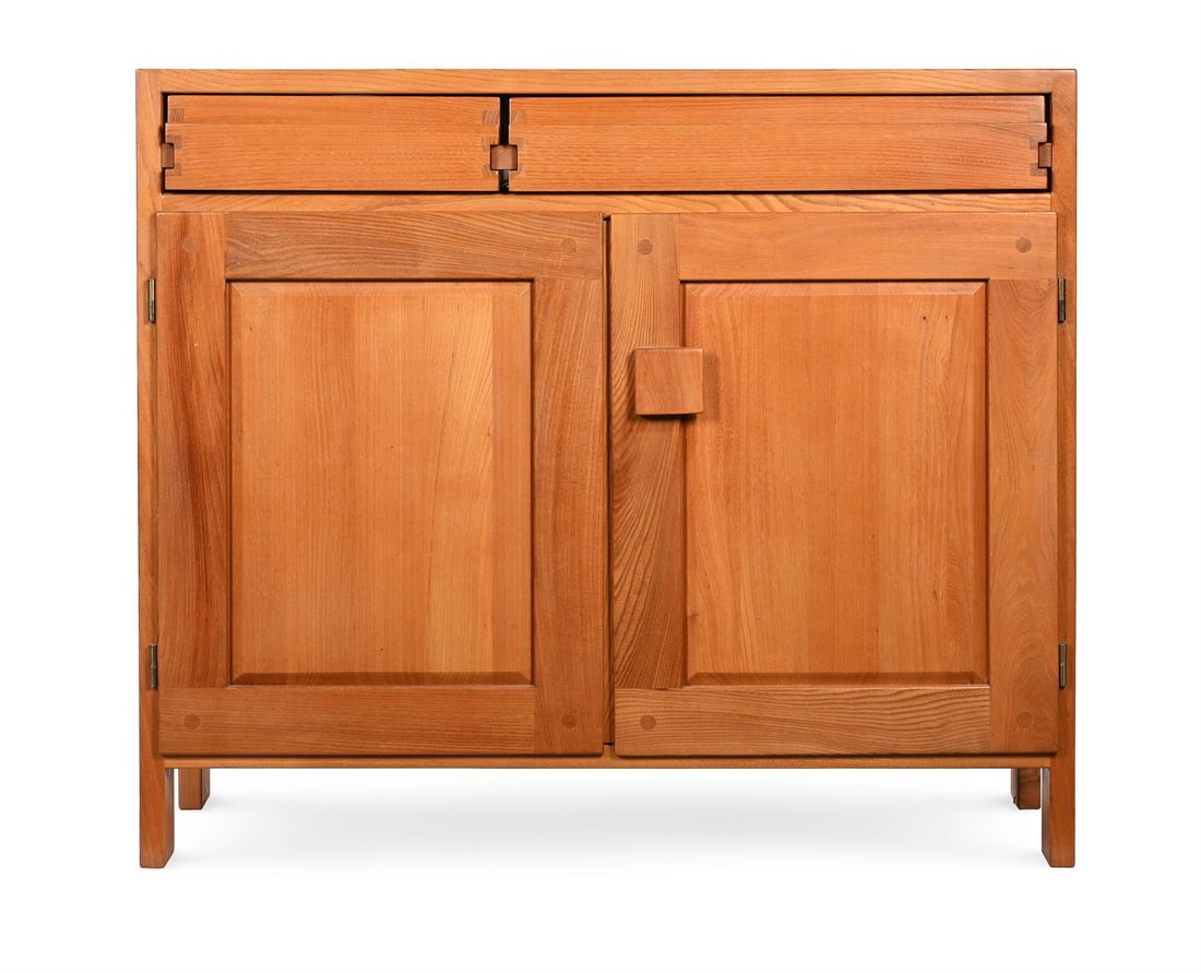 PIERRE CHAPO (FRENCH, 1927-1987), A 'MODEL RO7A' BUFFET; MID 20TH CENTURY: PIERRE CHAPO (FRENCH, 1927-1987)A 'MODEL RO7A' BUFFET; MID 20TH CENTURYElm, with two off-set drawers, above two cupboard doors 96cm high, 110cm wide, 40cm deep