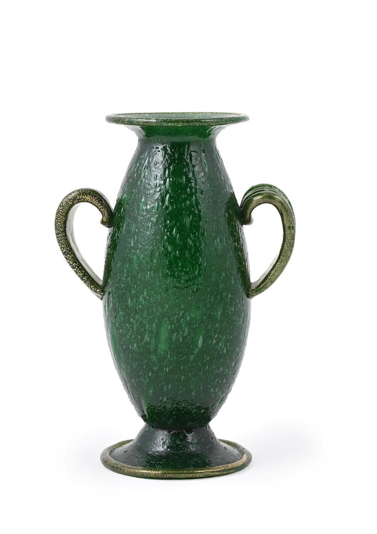 ATTRIBUTED TO ERCOLE BAROVIER, TWIN-HANDLED URN VASE, MID 20TH CENTURY: ERCOLE BAROVIER (ITALIAN, 1889-1974) ATTRIBUTEDTWIN-HANDLED URN VASE, MID 20TH CENTURYGreen bubbled glass with gold fleck inclusions to rim, base and handle23.5cm high