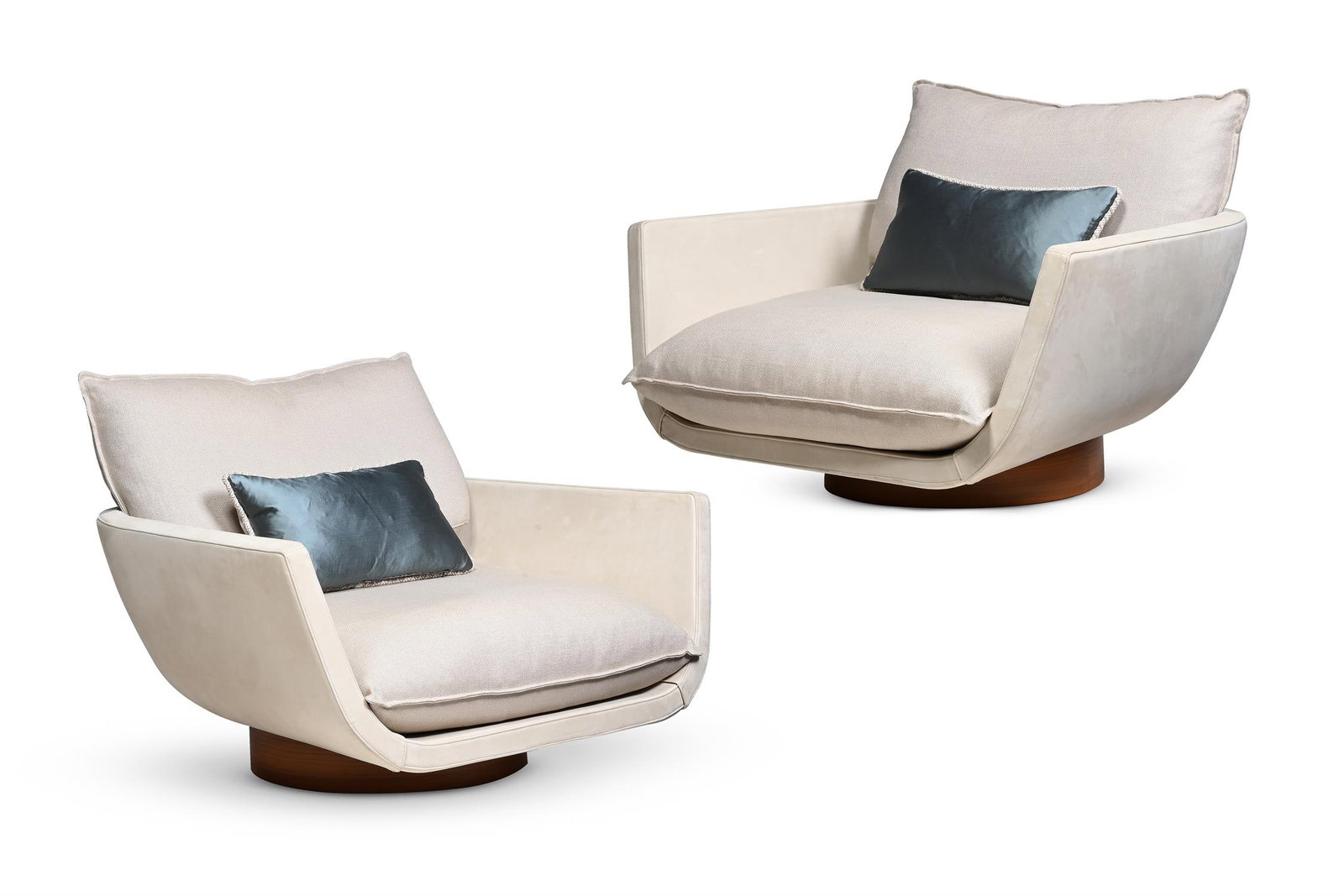 Y ABU PUSHELBERG STUDIO (CANADIAN, FD.1980), PAIR OF 'RUA IPANEMA' LOUNGE CHAIRS: YABU PUSHELBERG STUDIO (CANADIAN, FD.1980)PAIR OF 'RUA IPANEMA' LOUNGE CHAIRSCream suede upholstery, walnut swivel base, with pyrite bagdat caddesi weave fabric (removable) cushions54.5cm high, 108 cm