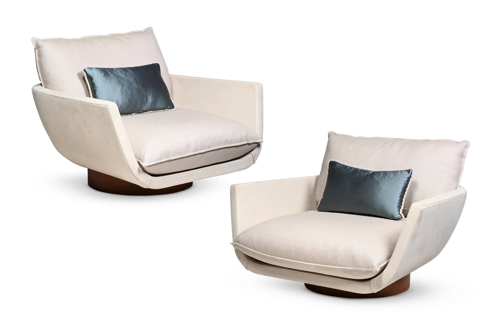 YABU PUSHELBERG STUDIO (CANADIAN, FD.1980), PAIR OF 'RUA IPANEMA' LOUNGE CHAIRS: YABU PUSHELBERG STUDIO (CANADIAN, FD.1980)PAIR OF 'RUA IPANEMA' LOUNGE CHAIRSCream suede upholstery, walnut swivel base, with pyrite bagdat caddesi weave fabric (removable) cushions54.5cm high, 108 cm