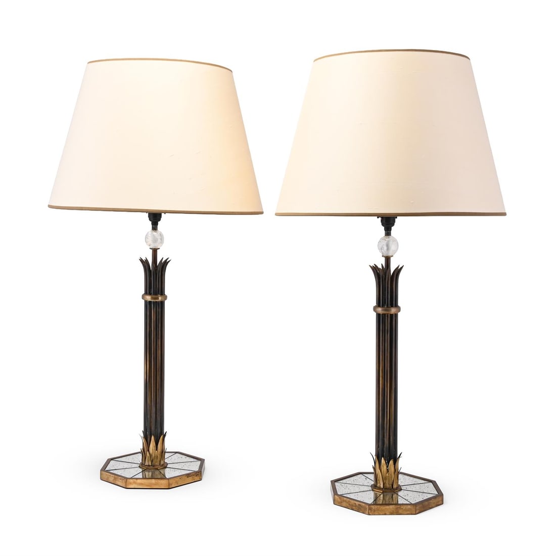 FRENCH, PAIR OF TABLE LAMPS; CIRCA 1960: FRENCHPAIR OF TABLE LAMPS; CIRCA 1960Brass, bronze column, rock crystal, mirrored octagonal base, cream fabric shades 76cm high, 45cm wide (with shade)Provenance:Purchased from Charles Saunders Antiqu