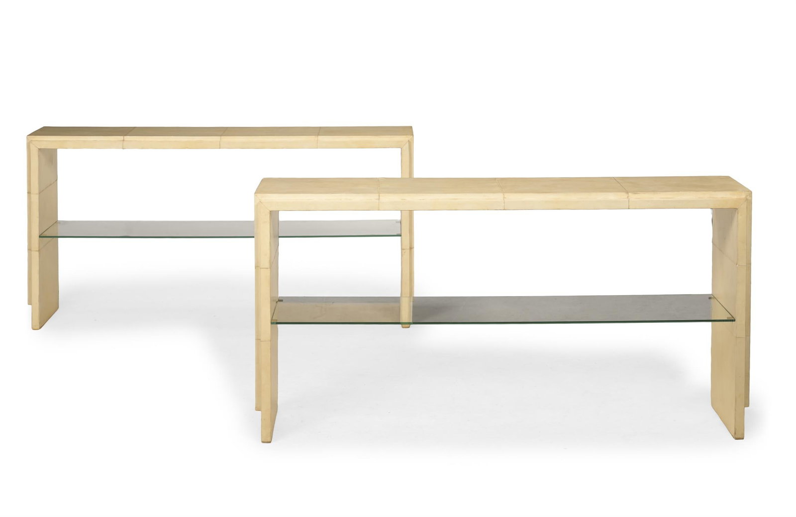 R&Y AGOUSTI (FRENCH, FD. 1989), PAIR OF CONSOLE TABLES; CIRCA 1990: R&Y AGOUSTI (FRENCH, FD. 1989)PAIR OF CONSOLE TABLES; CIRCA 1990Parchment, wooden frame, glassManufacturer's plaque to underside 'R&Y AGOUSTI' 80cm high, 156cm wide, 36cm deep