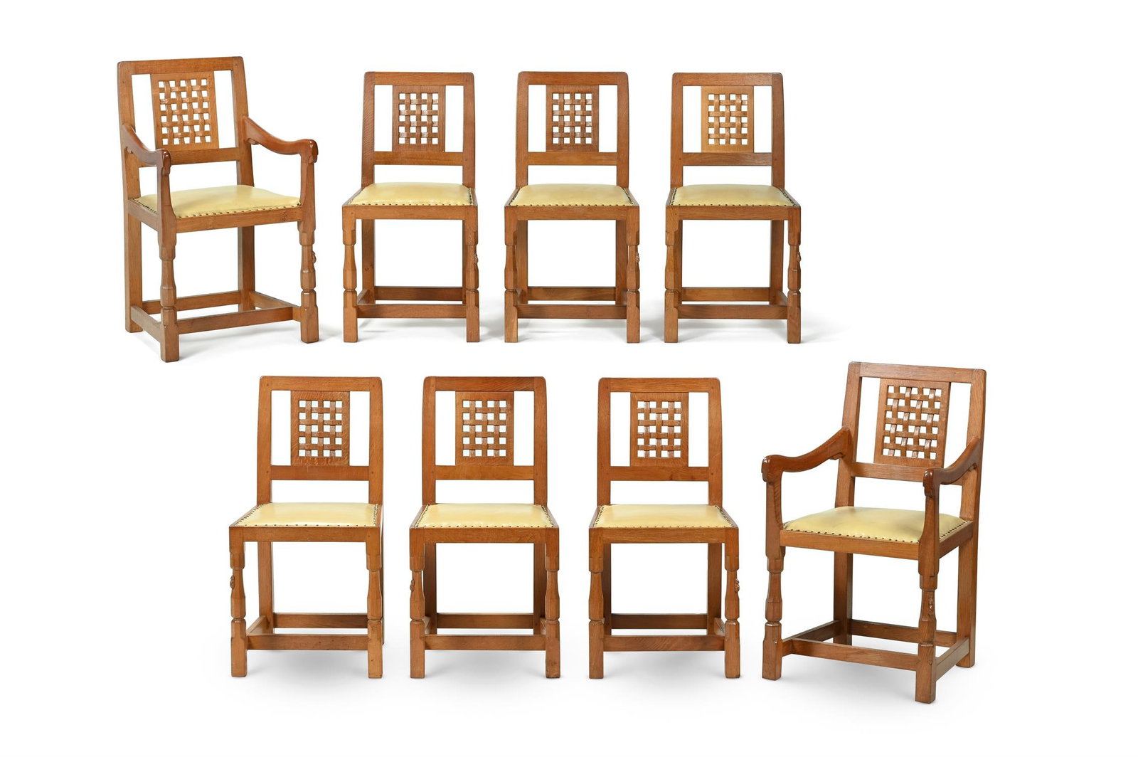 ROBERT 'MOUSEMAN' THOMPSON, SET OF EIGHT DINING CHAIRS; MID 20TH CENTURY: ROBERT 'MOUSEMAN' THOMPSON SET OF EIGHT DINING CHAIRS; MID 20TH CENTURYOak, leatherComprising six dining and two carversEach with carved mouse to legDining: 85cm high, 44cm wide, 38.5cm deepCarver: 90