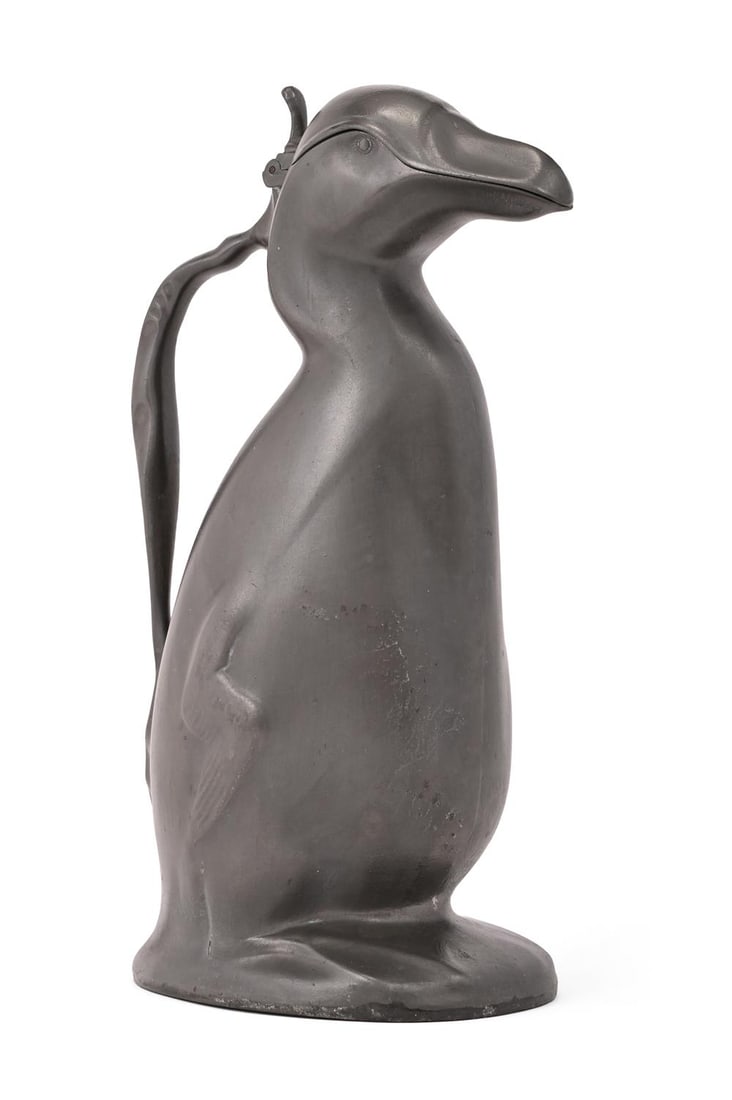 HUGO LEVEN (GERMAN, 1874-1956), FOR KAYSERZINN, AUK JUG; CIRCA 1905: HUGO LEVEN (GERMAN, 1874-1956) FOR KAYSERZINNAUK JUG; CIRCA 1905Pewter; penguin shaped with openable hinged topModel no. 4433Maker's marks and model number stamped to underside29cm highLiterature:Paul