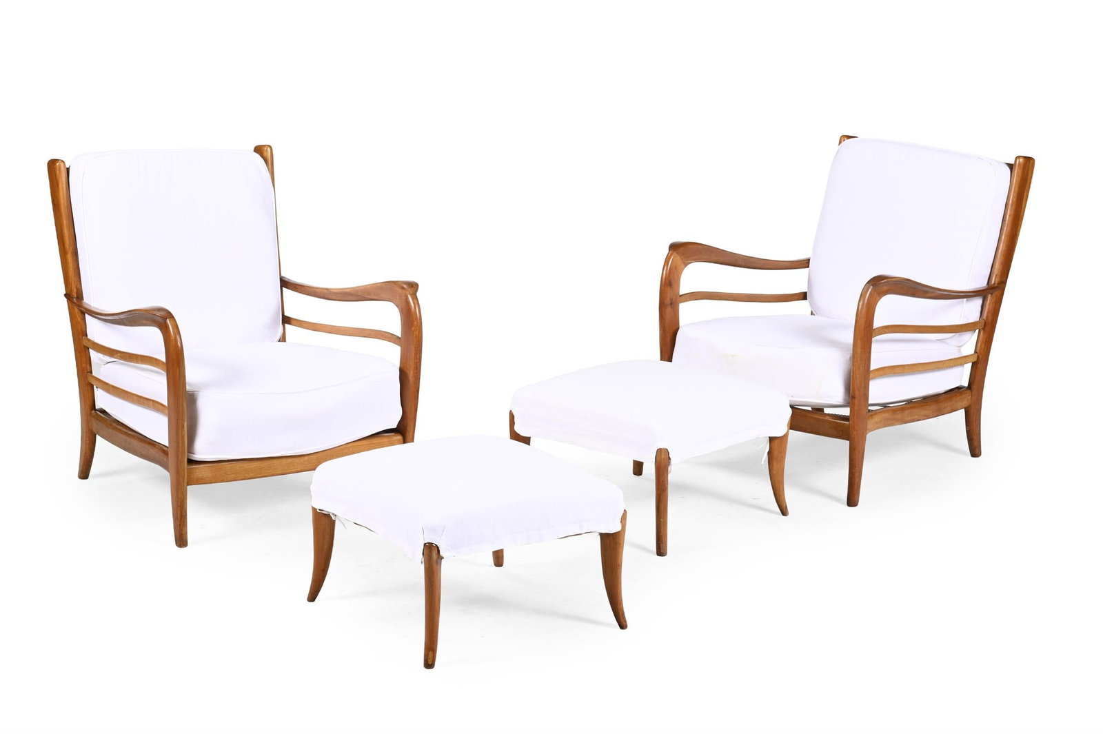 IN THE MANNER OF PAOLO BUFFA (ITALIAN, 1903- 1970), A PAIR OF LOUNGE CHAIRS WITH FOOTSTOOLS: IN THE MANNER OF PAOLO BUFFA (ITALIAN, 1903- 1970)A PAIR OF LOUNGE CHAIRS WITH FOOTSTOOLS; MID 20TH CENTURY Italian cherrywood, white linen covered cushioned upholstery, chained sprung supports Chair: