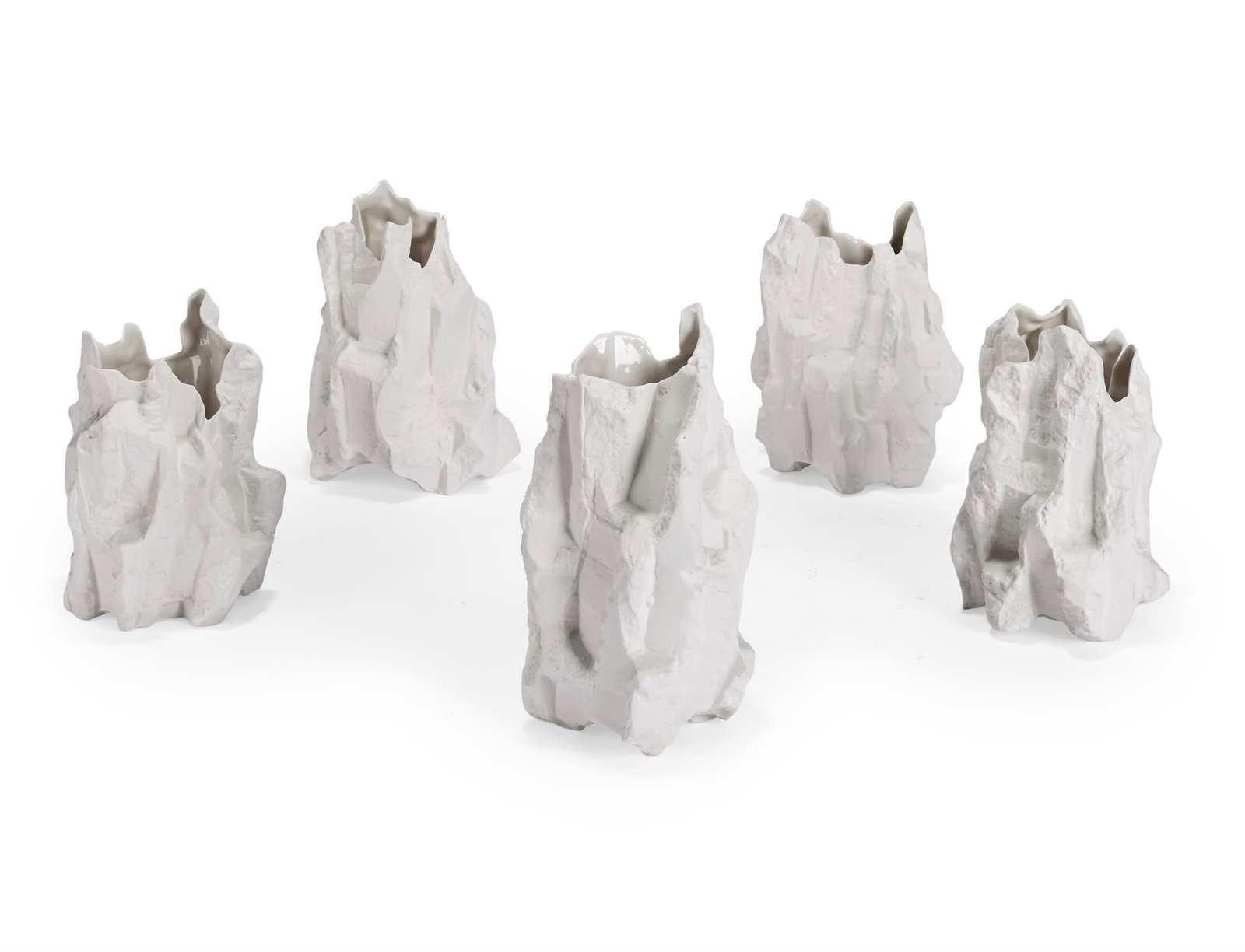 λ SIMON KIDD (IRISH), FIVE VESSELS; 2020: λ SIMON KIDD (IRISH)FIVE VESSELS; 2020Slip cast porcelainComprising designs 'CUT NO. 4, 20,21, 23, 24'Largest: 20cm high, 29cm wide, 22cm deep λ indicates that this lot may be subject to Dro