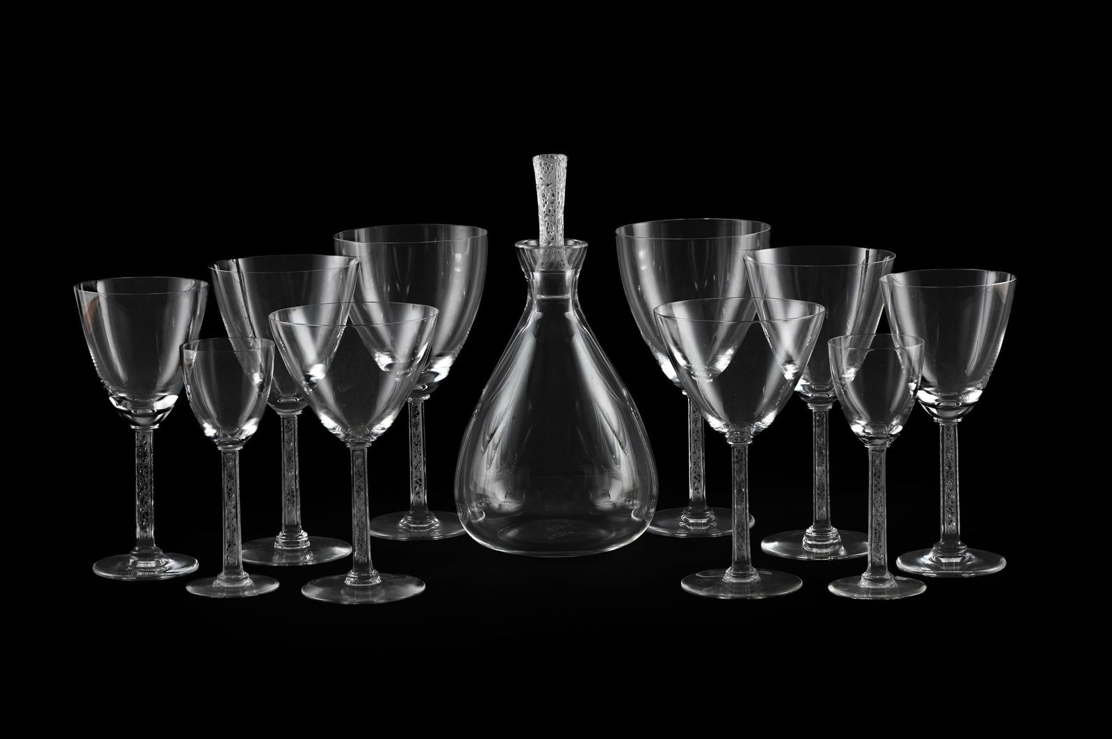 RENÉ LALIQUE (FRENCH, 1860-1945), PART 'PHALSBOURG' STEMWARE SERVICE; DESIGNED 1924; POST 1945: RENÉ LALIQUE (FRENCH, 1860-1945)PART 'PHALSBOURG' STEMWARE SERVICE; DESIGNED 1924; POST 1945Clear and frosted glass; stems with relief moulded fruiting vines Comprising: sixteen white wine, sixte