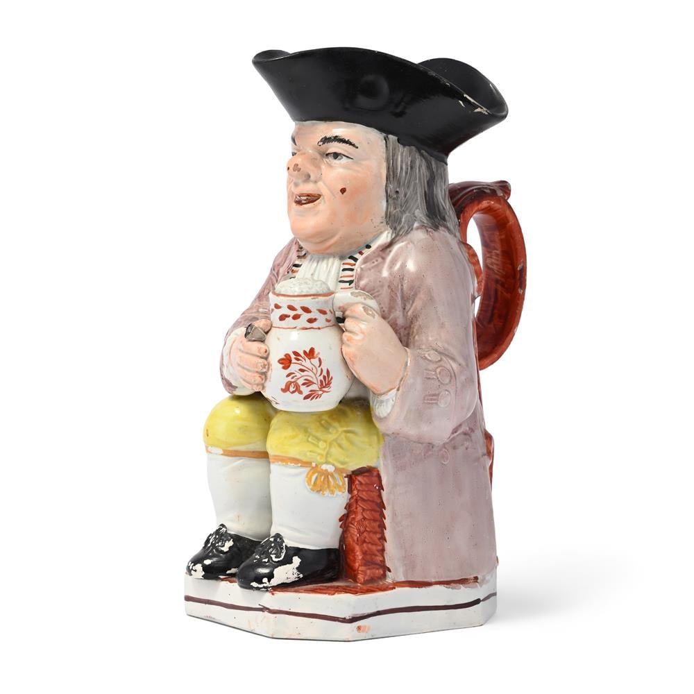 A STAFFORDSHIRE PEARLWARE PIPE-SMOKING TOBY JUG, CIRCA 1830 - 2