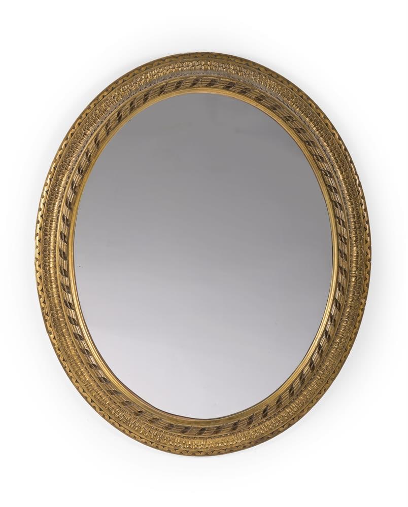 AN OVAL GILT WALL MIRROR, IN GEORGE III STYLE, 20TH CENTURY: AN OVAL GILT WALL MIRROR IN GEORGE III