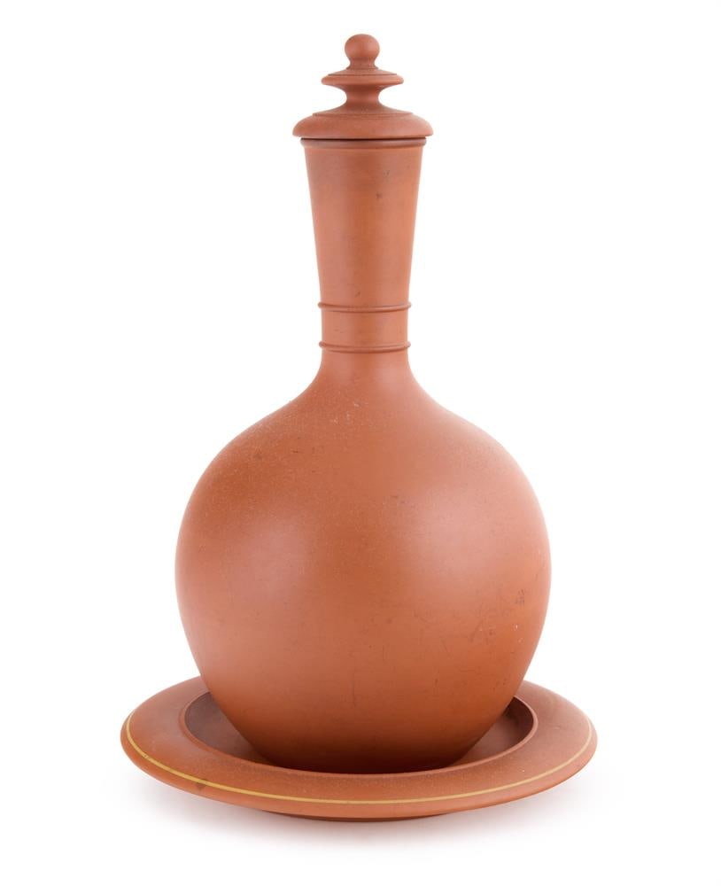 TORQUAY POTTERY, LIDDED VASE AND STAND, 20TH CENTURY: TORQUAY POTTERY LIDDED VASE AND STAND, 20TH CENTURY Terracotta, gilded band to stand Impressed to underside '2' and '378' 28cm high Stand 20cm diameter Condition Report: PLEASE NOTE: