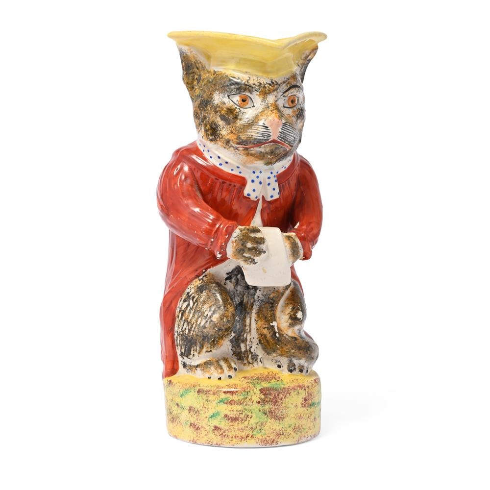 A STAFFORDSHIRE POTTERY CHARACTER JUG MODELLED AS A CAT, LATE 19TH CENTURY: A STAFFORDSHIRE POTTERY CHARACTER JUG MODELLED AS AN ANTHROPROMORPHISED CAT POSSIBLY WILLIAM KENT LTD., LATE 19TH CENTURY 27.5cm high Condition Report: PLEASE NOTE: ALL LOTS ARE LOCATED AT SACKVILLE