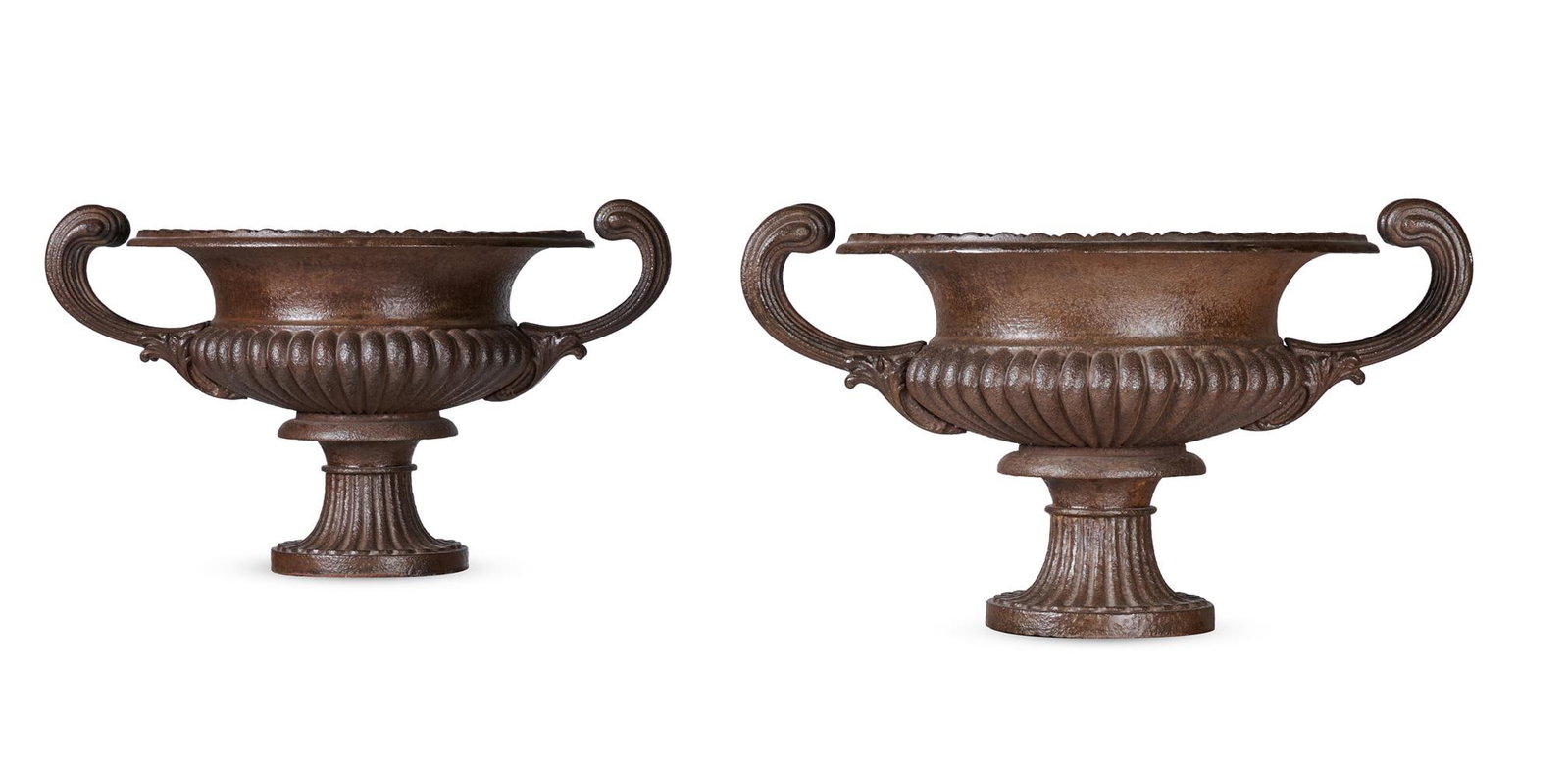 A PAIR OF CAST IRON TWIN HANDLED URNS, 19TH CENTURY: A PAIR OF CAST IRON TWIN HANDLED URNS 19TH CENTURY the urns 40.5cm high, 69.5cm wide across the handles Condition Report: PLEASE NOTE: ALL LOTS ARE LOCATED AT SACKVILLE WEST STORAGE IN ANDOVER (SP10