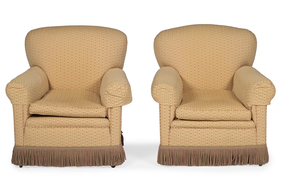 A PAIR OF DEEP SEATED TRADITIONAL UPHOLSTERED ARMCHAIRS, CIRCA 1910 - 2