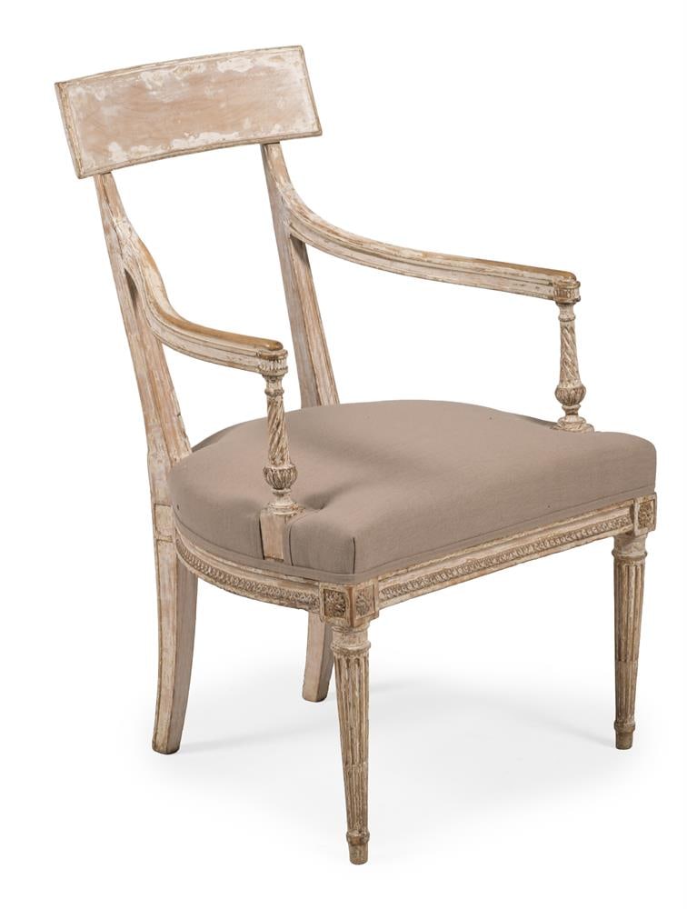 A STRIPPED PINE AND PART PAINTED ARMCHAIR, CONTINENTAL, 18TH CENTURY: A STRIPPED PINE AND PART PAINTED ARMCHAIR CONTINENTAL, 18TH CENTURY Written turned arms, upholstered seat on fluted tapering legs 94cm high, 61cm wide, 50cm deep Condition Report: PLEASE NOTE: ALL