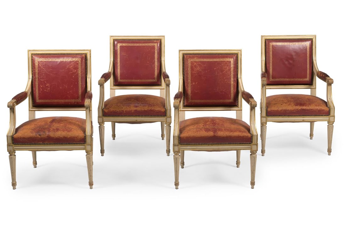 A SET OF FOUR PAINTED AND PARCEL GILT FAUTEUIL, IN LOUIS XVI STYLE, FIRST HALF 20TH CENTURY: A SET OF FOUR PAINTED AND PARCEL GILT FAUTEUIL IN LOUIS XVI STYLE, FIRST HALF 20TH CENTURY With gilt tooled crimson leather upholstery 89cm high, 57cm wide, 53cm deep Condition Report: PLEASE NOTE: