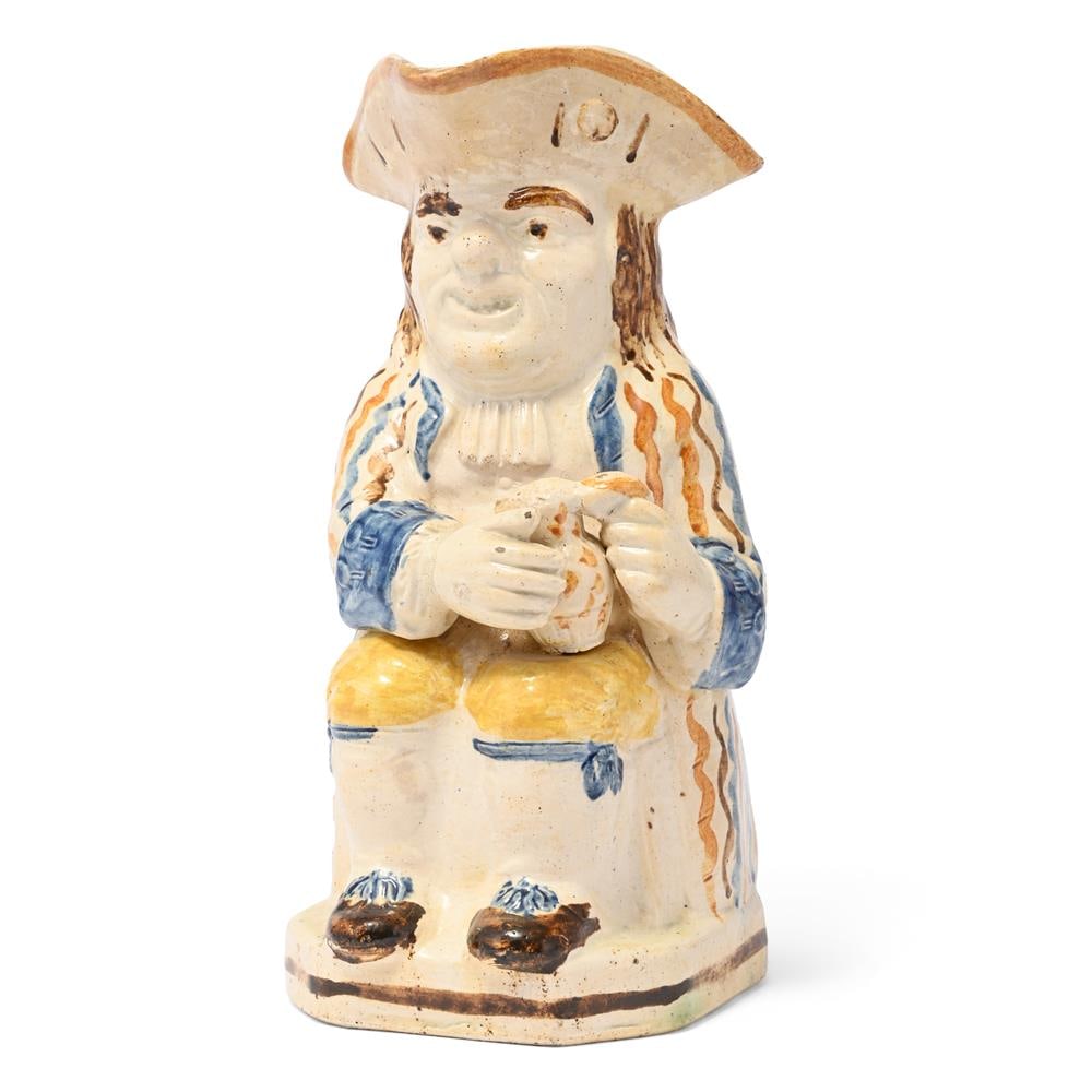 A STAFFORDSHIRE CREAMWARE PRATT-TYPE TOBY JUG, LATE 18TH CENTURY: A STAFFORDSHIRE CREAMWARE PRATT-TYPE TOBY JUG LATE 18TH CENTURY Decorated with Pratt-type coloured slip 25cm high Condition Report: PLEASE NOTE: ALL LOTS ARE LOCATED AT SACKVILLE WEST STORAGE IN