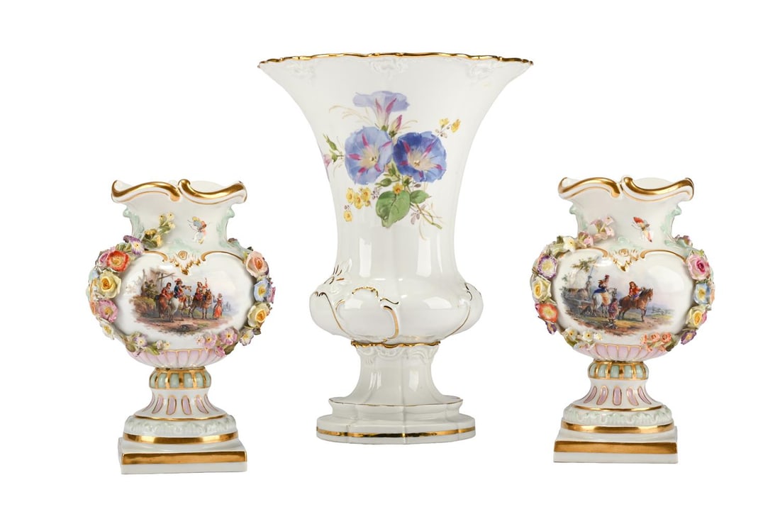 A PAIR OF MEISSEN FLOWER-ENCRUSTED URNS, LATE 19TH CENTURY, TOGETHER WITH A TRUMPET VASE: A PAIR OF MEISSEN FLOWER-ENCRUSTED URNS LATE 19TH CENTURY Painted with panels of Watteauesques, blue crossed swords marks, 15cm high TOGETHER WITH A Meissen (outside decorated) trumpet vase painted