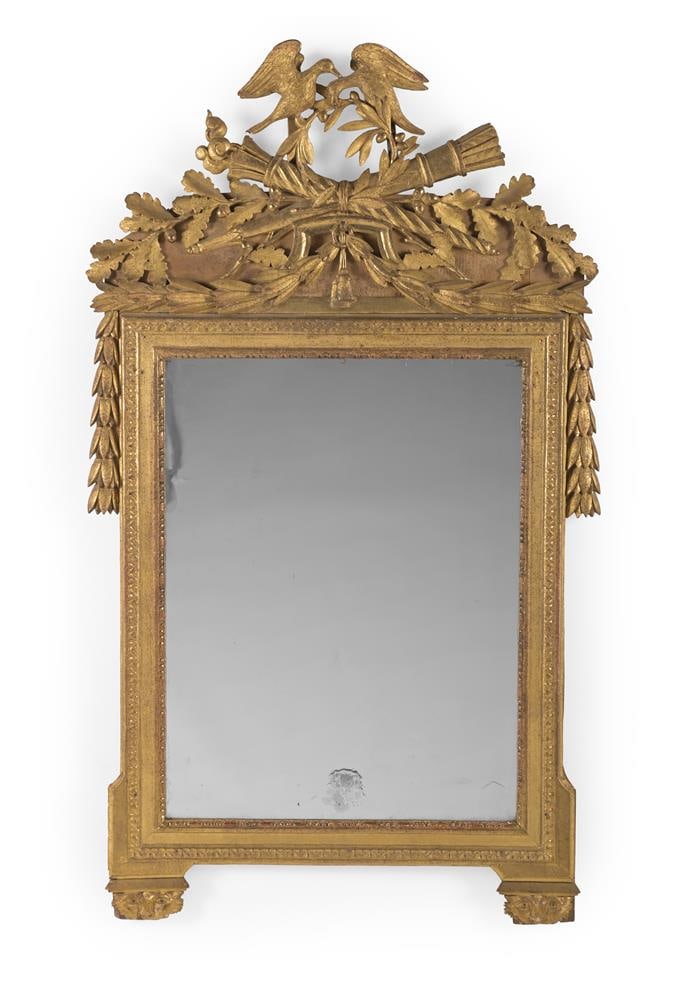 A LOUIS XVI CARVED WOOD AND GILT GESSO WALL MIRROR, CIRCA 1790 (1 of 3)