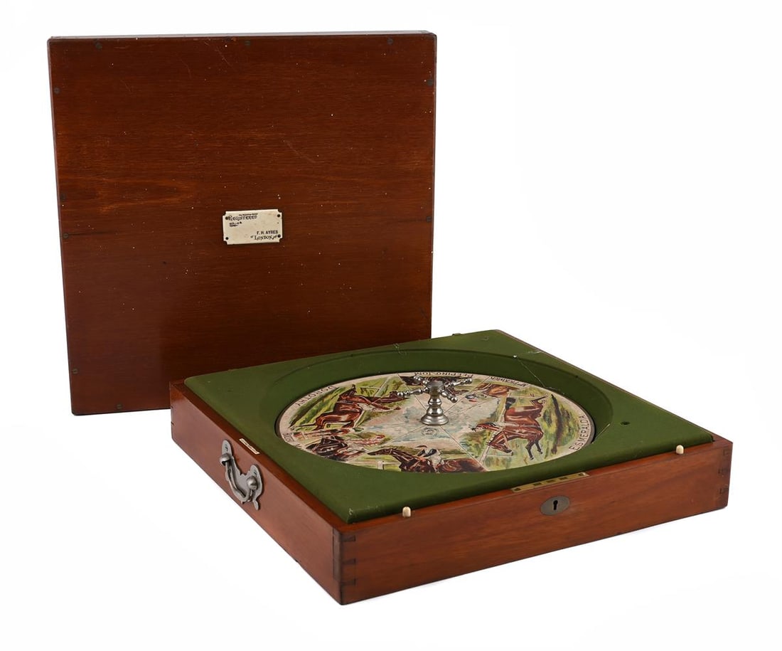 Y A MAHOGANY CASED 'SANDOWN' HORSE RACING GAME, BY F.H. AYRES, LONDON, CIRCA 1900: Y A MAHOGANY CASED 'SANDOWN' HORSE RACING GAME BY F.H. AYRES, LONDON, CIRCA 1900 The case with engraved label to the lid with maker's details and further similar to the interior