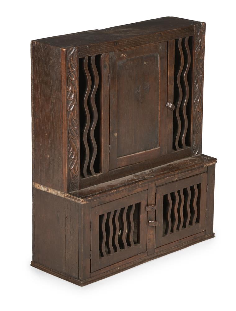 AN OAK MURAL DOLE CUPBOARD, POSSIBLY WELSH, LATE 18TH CENTURY AND LATER: AN OAK MURAL DOLE CUPBOARD POSSIBLY WELSH, LATE 18TH CENTURY AND LATER 81cm high, 68cm wide, 27cm deep Condition Report: PLEASE NOTE: ALL LOTS ARE LOCATED AT SACKVILLE WEST STORAGE IN ANDOVER (SP10
