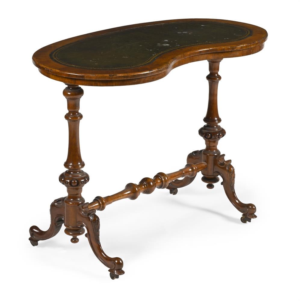 A WALNUT KIDNEY SHAPED WRITING TABLE, CIRCA 1860 (1 of 3)